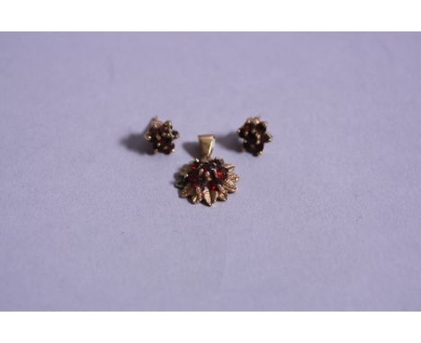 A 9CT SUITE AND A RUBY AND GOLD PENDANT, and a pair of earrings, approximate weight 2.8 grams