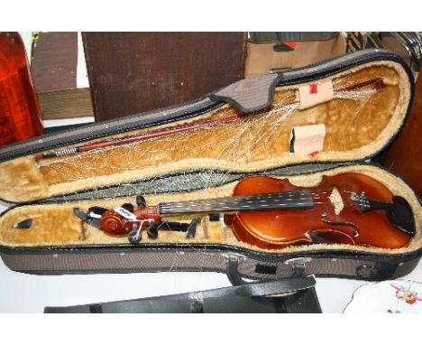 A CASED VIOLIN AND BOW, with paper label inscribed Tatra by Rosetti, Stradivarius model