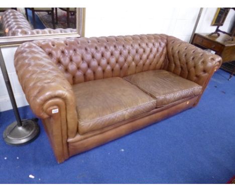 A TAN LEATHER CHESTERFIELD SOFA (sd)