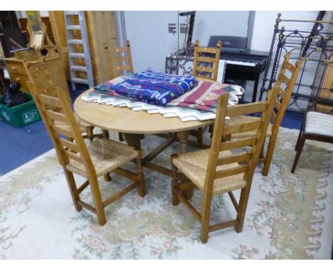 A NIGEL GRIFFITHS LIGHT OAK CIRCULAR DROP-LEAF DINING TABLE, approximate size diameter 137cm x height 71cm and six ladder bac