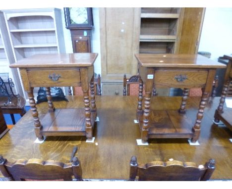 A PAIR OF SMALL OAK OCCASIONAL TABLES, with single drawers on bobbin turned supports and under shelves
