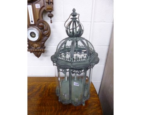 A MODERN OCTAGONAL HANGING OR FREESTANDING LANTERN, with bowed glass panels and hinged top, approximate height 72cm
