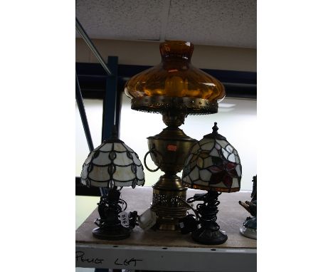 TWO SMALL TIFFANY STYLE DECO LAMPS, together with a larger oil lamp design electric lamp (3)