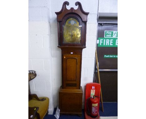 AN OAK AND MAHOGANY EIGHT DAY LONG CASE CLOCK, swan neck pediment supported on columns either side door to arched brass 12' d