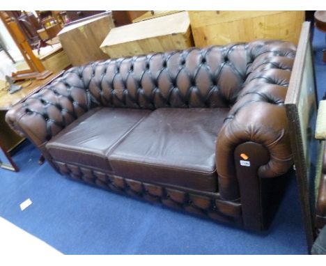 A BROWN LEATHER CHESTERFIELD STYLE SOFA BED