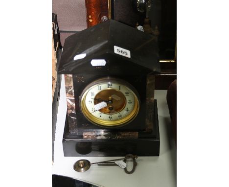 AN ARCHITECTURAL BLACK MARBLE MANTLE CLOCK, Arabic numeral chapter ring, stepped plinth base, approximately 20cm x 13.5cm x 2