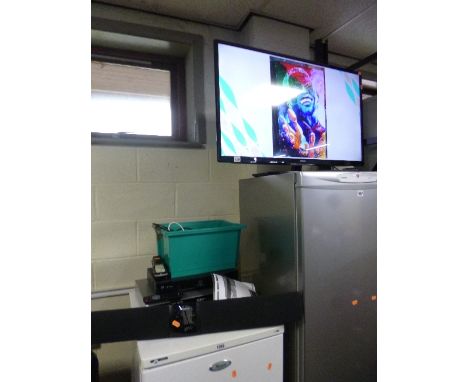 A POLAROID 39' LED TV, Polaroid sound box, etc (three remotes)