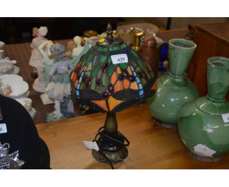 A Tiffany style table lamp and shade