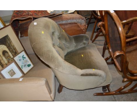 A late Victorian mahogany and button back armchair