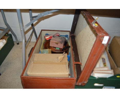 A brown leather suitcase containing button samples, turned wooden bowls and Indian carved hardwood box etc.