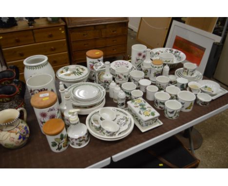 A large quantity of Portmeirion china to include storage jars, mantel clock, bowls, teaware, vases etc.