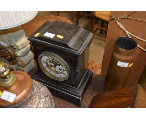 A late Victorian black slate two hole mantel clock