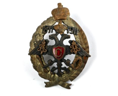 Imperial Russian garrison or local troops officer's badge. Imperial eagle superimposed on wreath, dates 1811-1911 by crown, '