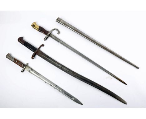 Three bayonets. A French M1874 Gras bayonet, the hilt and scabbard numbered '18128'; a Victorian Enfield bayonet, and a Belgi
