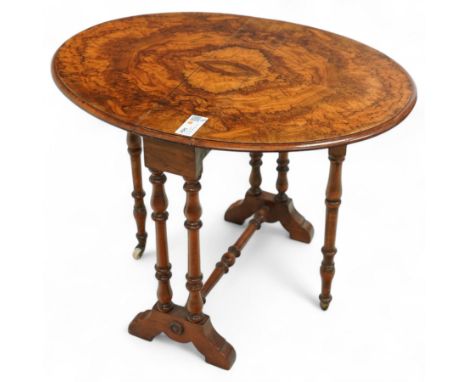 Late Victorian figured walnut Sutherland tea table, oval fold-over top with striking book-matched veneers, on turned supports