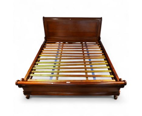 20th century cherry wood Super King size sleigh bed and slatted wood base, panelled headboard and footboard on chamfered scro