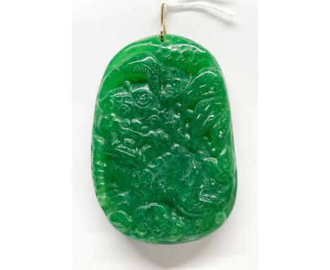 A Chinese carved jade/hardstone pendant amulet, H. 6.5cm.