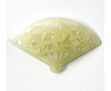 A finely carved Chinese jade fan, W. 7cm.