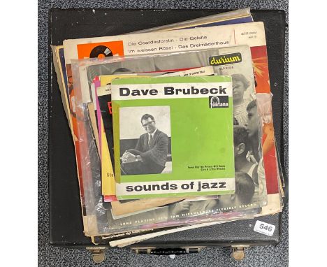 A Ferograph vintage reel to reel tape recorder and a quantity of records.
