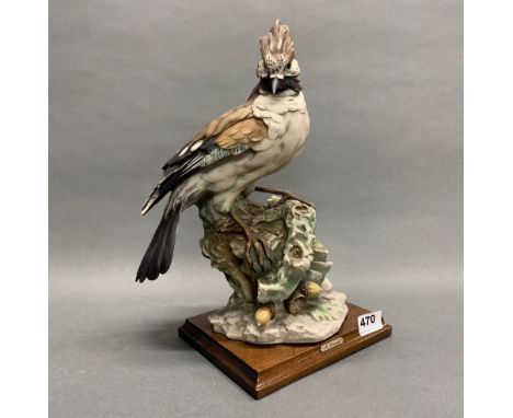 A large resin figure of a Jay on a wooden base after R. Pennati, H. 36cm.