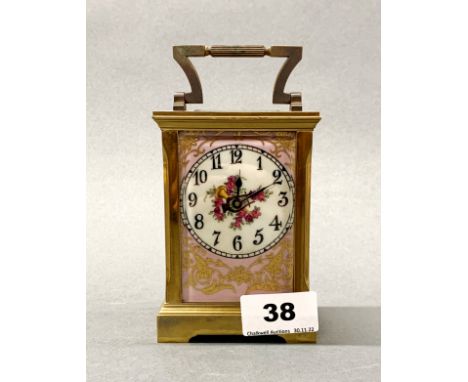 A French gilt brass and porcelain carriage clock, H. 15cm.