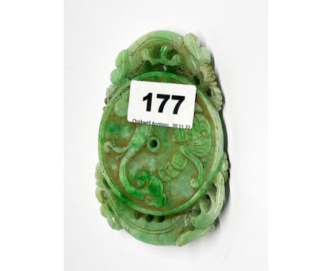 A large Chinese carved jade amulet of young dragons with lotus and peach, 11 x 8 x 1.5cm.