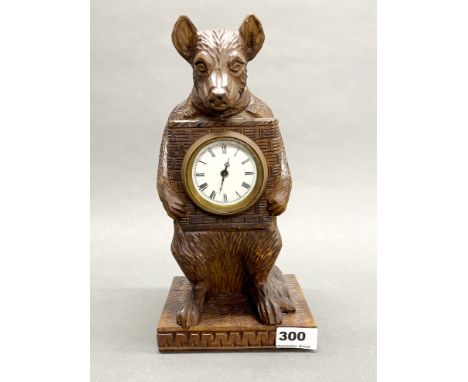 A carved wooden Black Forest type mantle clock, H. 30.