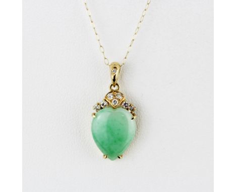 An 18ct yellow gold pendant set with cabochon jade and brilliant cut diamonds, L. 2.1cm, on a 9ct yellow gold chain, L. 40cm.