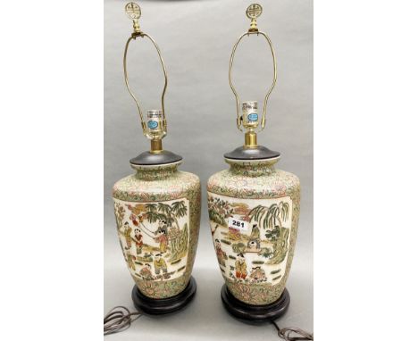 A pair of Chinese hand enamelled porcelain lamp bases, H. with shade frame 67cm.