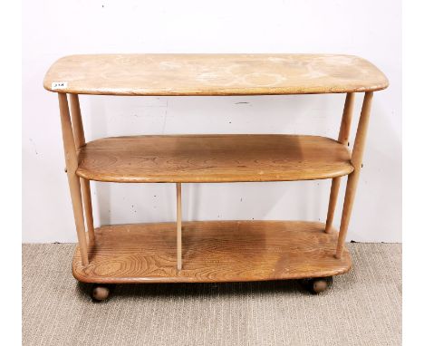 An Ercol light oak three-tier tea trolley on wheels, L. 92cm, H. 71cm. Extensive stains to top.