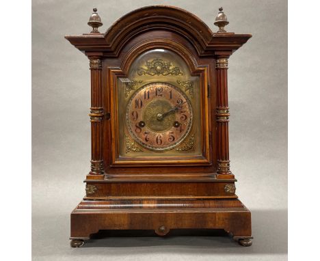 A 19th century gilt brass and mahogany veneered cased mantel clock, H. 36cm, W. 17cm.