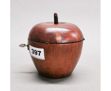 A wooden apple tea caddy, H. 12cm, Dia. 11cm.