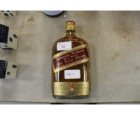 An old 13.5 fl ozs bottle of Johnnie Walker Red Label Scotch whisky