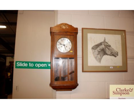 A 1920's oak wall clock