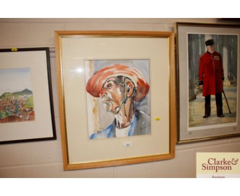 A framed and glazed watercolour portrait signed to bottom right 