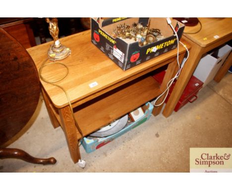 A good quality light oak two tier side table