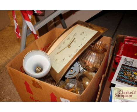 A box containing various glassware, wall lights, a wall clock etc. 