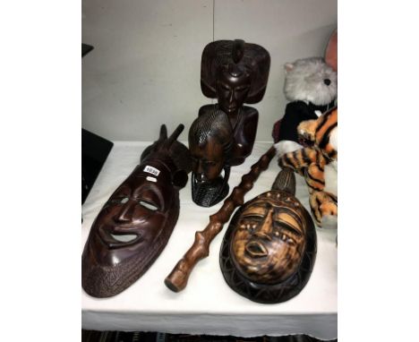 2 carved wooden African busts, 2 face masks and 1 other item
