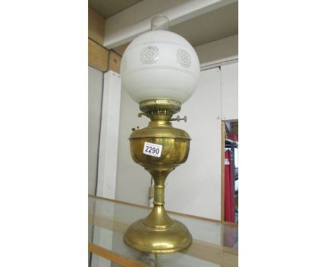 A brass oil lamp complete with shade and chimney. (collect only).