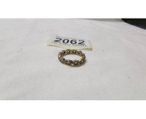 A 9ct gold eternity ring, size K. 2.2 grams.