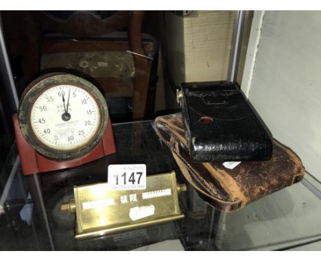 A vintage Kodak timer, folding autographic brownie and deco perpetual desk calendar