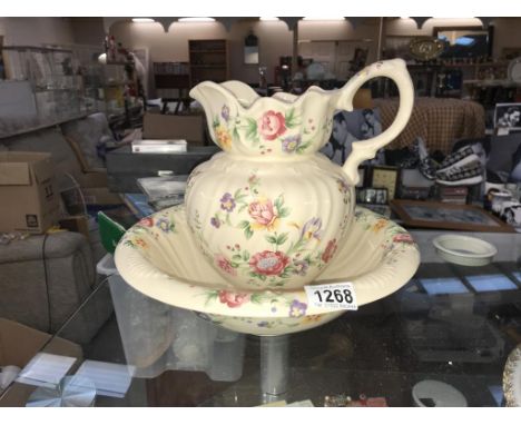 A pink floral basin and jug