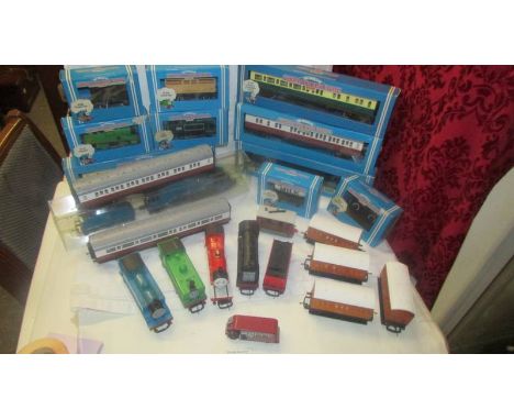 A good lot of Hornby Thomas the Tank Engine 'OO' gauge and unboxed engines, carriages, wagons, accessories and two empty boxe