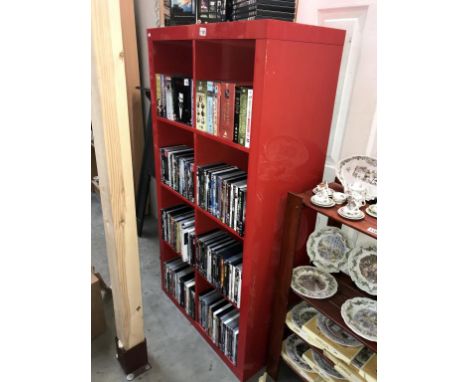 A red pigeon hole type bookcase shelf unit (79cm x 39cm x 150cm) (Collect only)