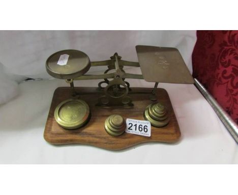 A set of brass postal scales.