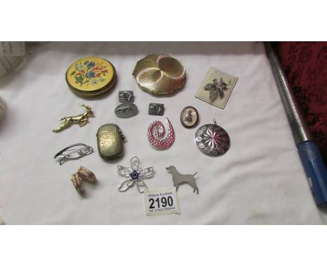 A mixed lot including Stratton compact, brooches etc.,