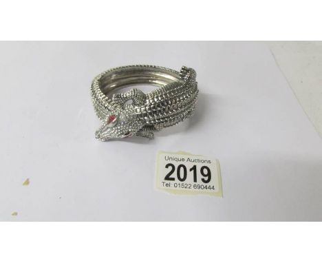 A Butler and Wilson crocodile bangle.