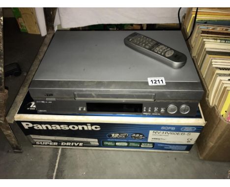 A vintage boxed Panasonic video cassette recorder NV-HV60 EB-S plus a JVC VCR