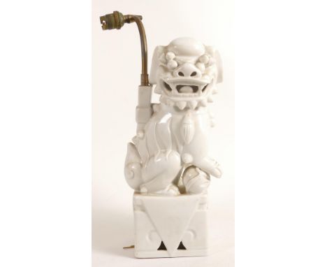 Chinese white porcelain Lion Dog table lamp (later lamp conversion), height 34cm. 