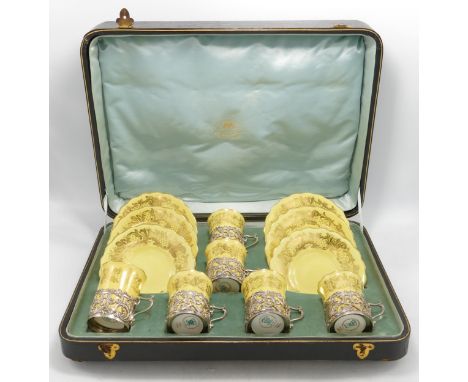 Cased early 20th century Coalport cups &amp; saucers set with ornate silver handles, 167g of silver. 